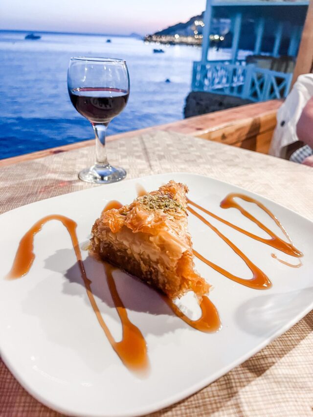 Cave of Nikolas baklava dessert and glass of red wine