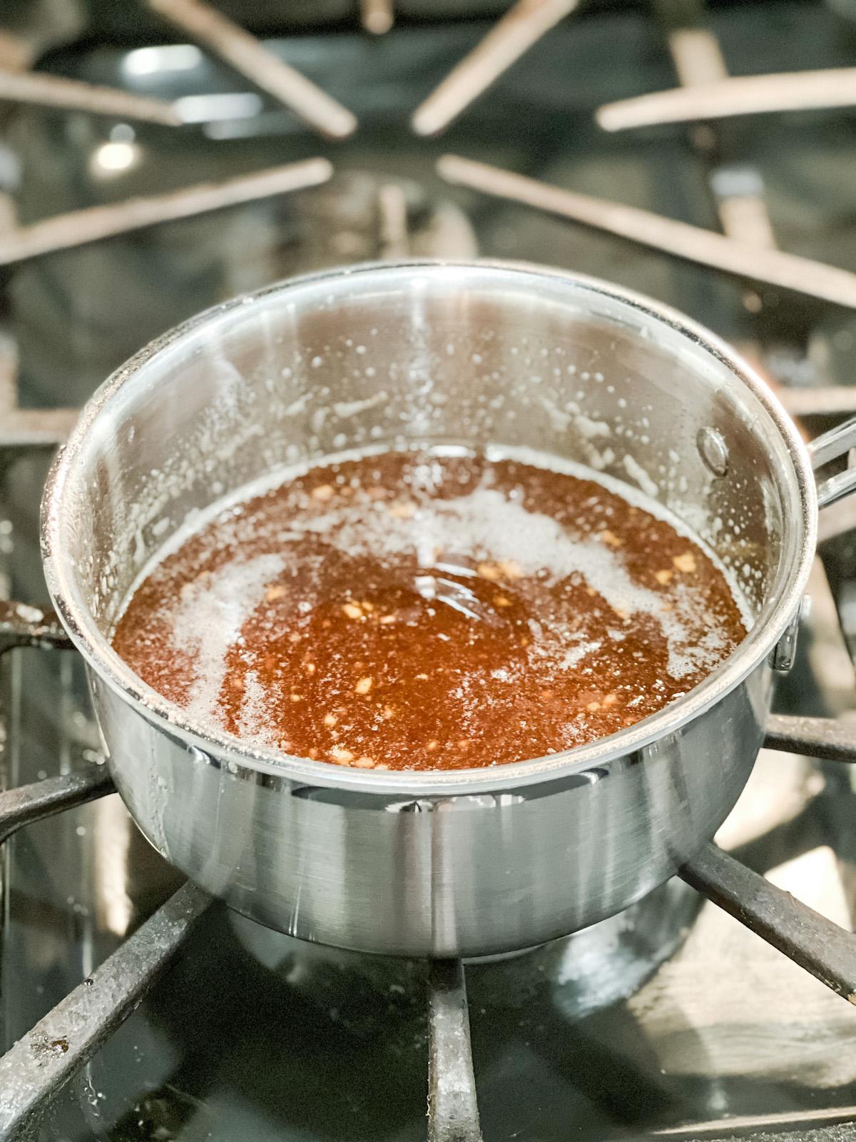 Honey glaze for ham in saucepan