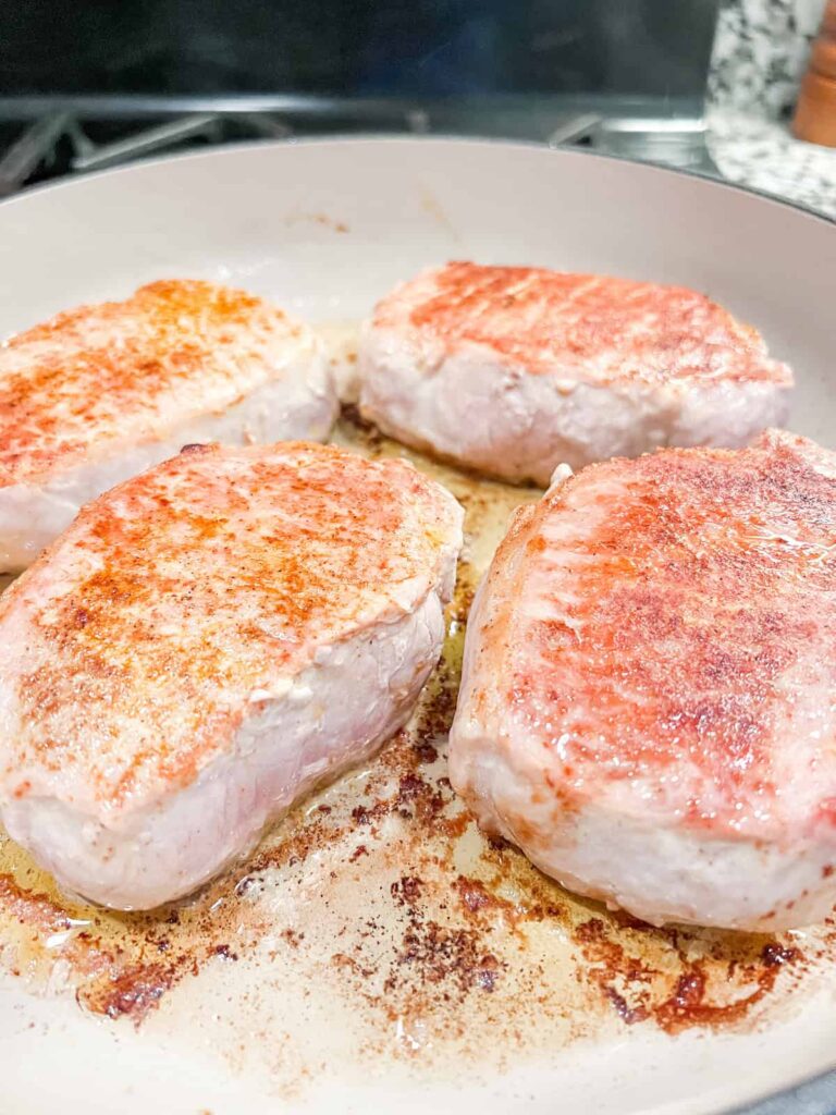 Pork chops in frying pan
