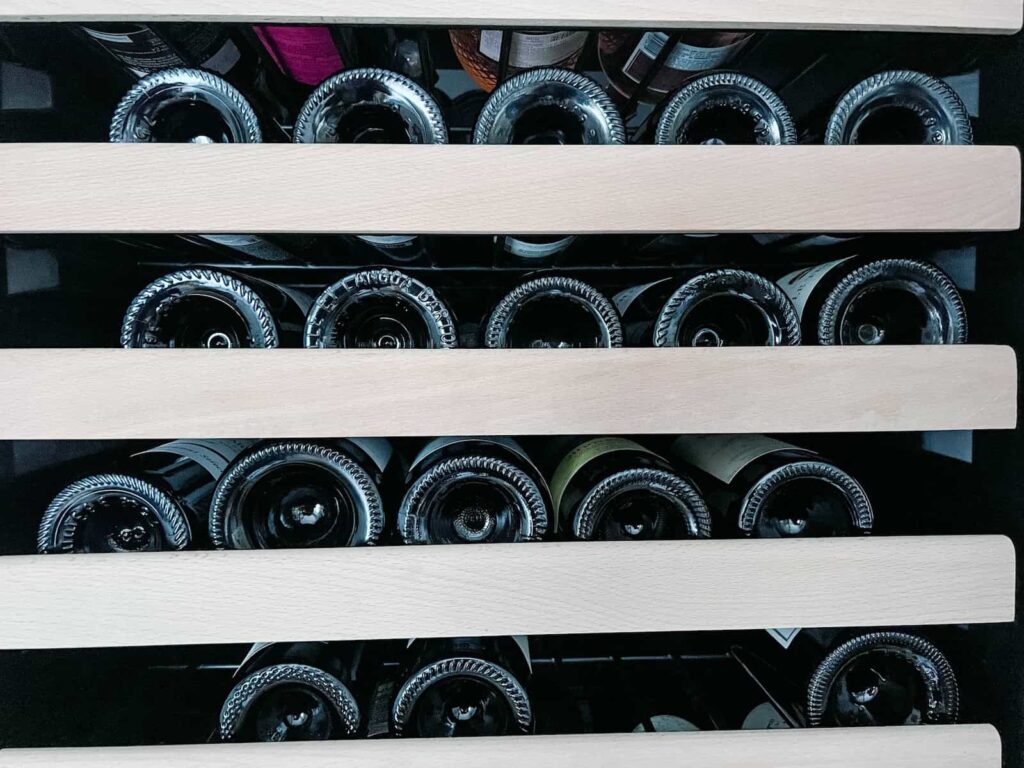 Red wine on wine cooler shelves
