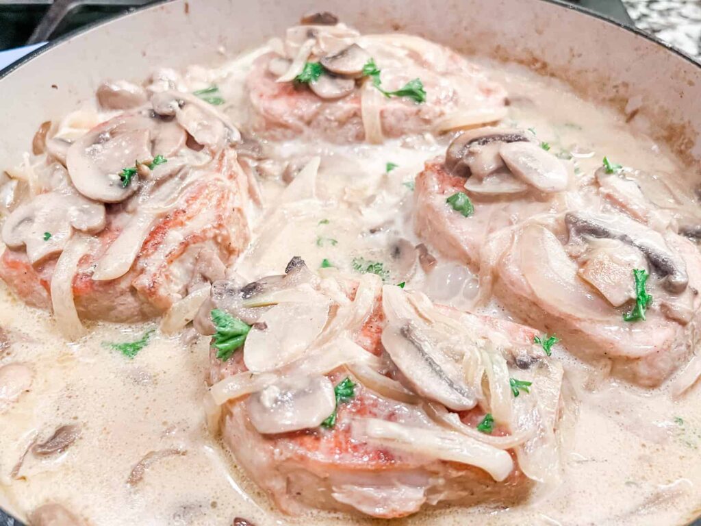 Smothered pork chops in pan