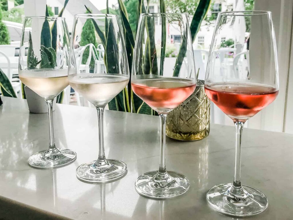 Coastal Wine flight of white and rose wines on a bar