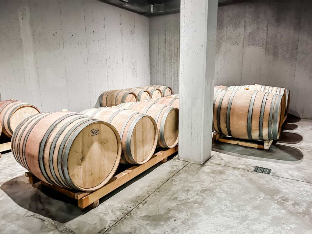 Oak barrels in a wine cellar underground