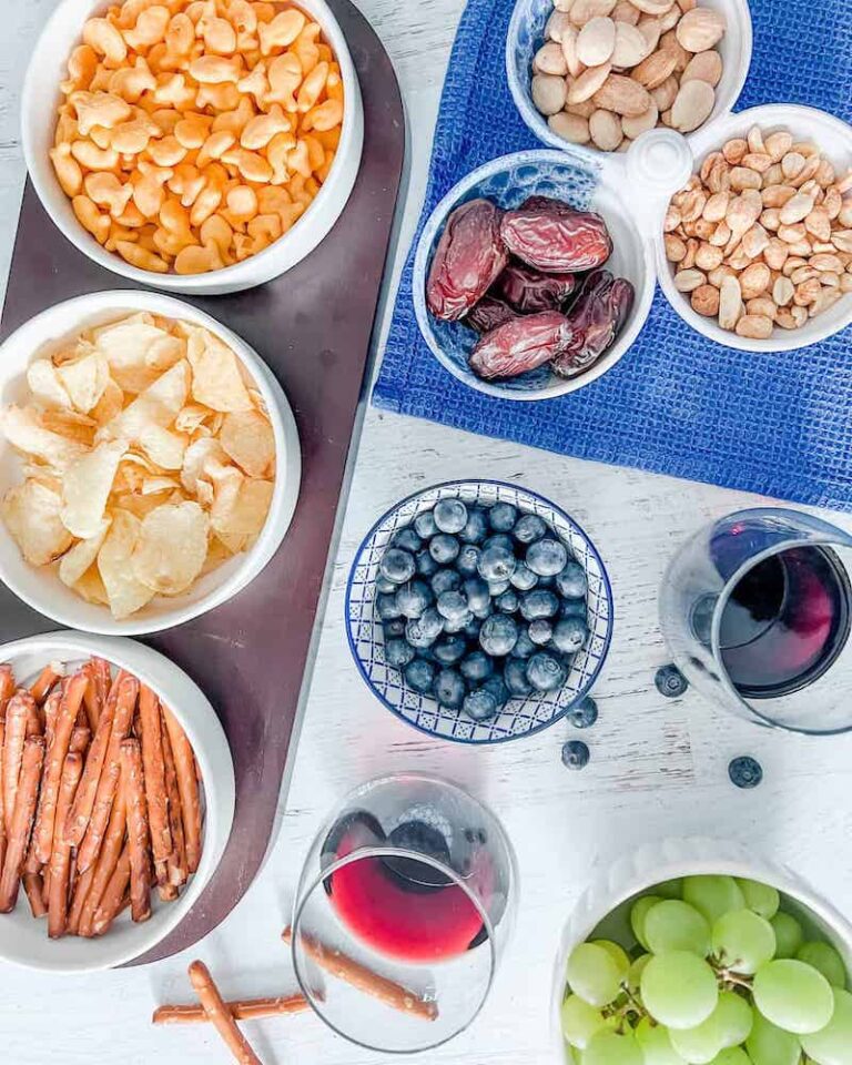 Snacks with wine on a table feature