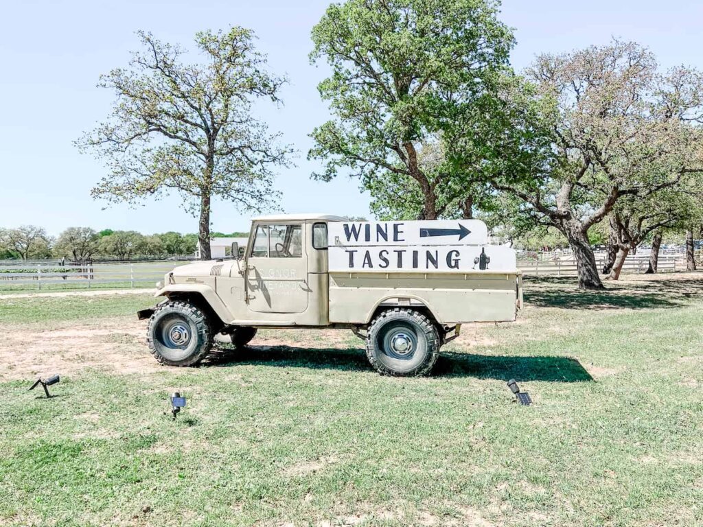 Signor Vineyards pick-up truck with wine tasting sign