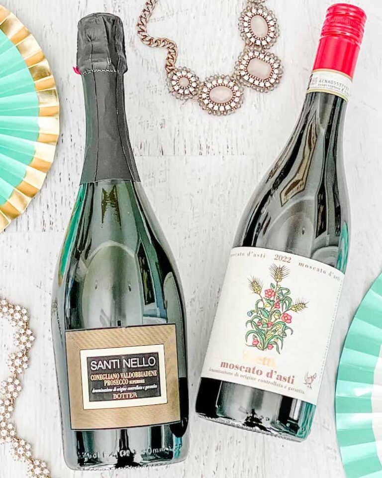 Bottles of Prosecco and Moscato d'Asti with party decor
