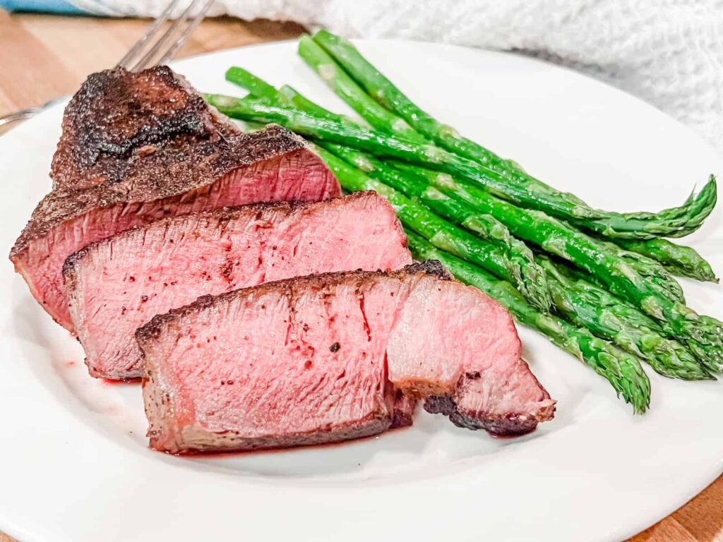 Filet mignon steak with asparagus on a plate