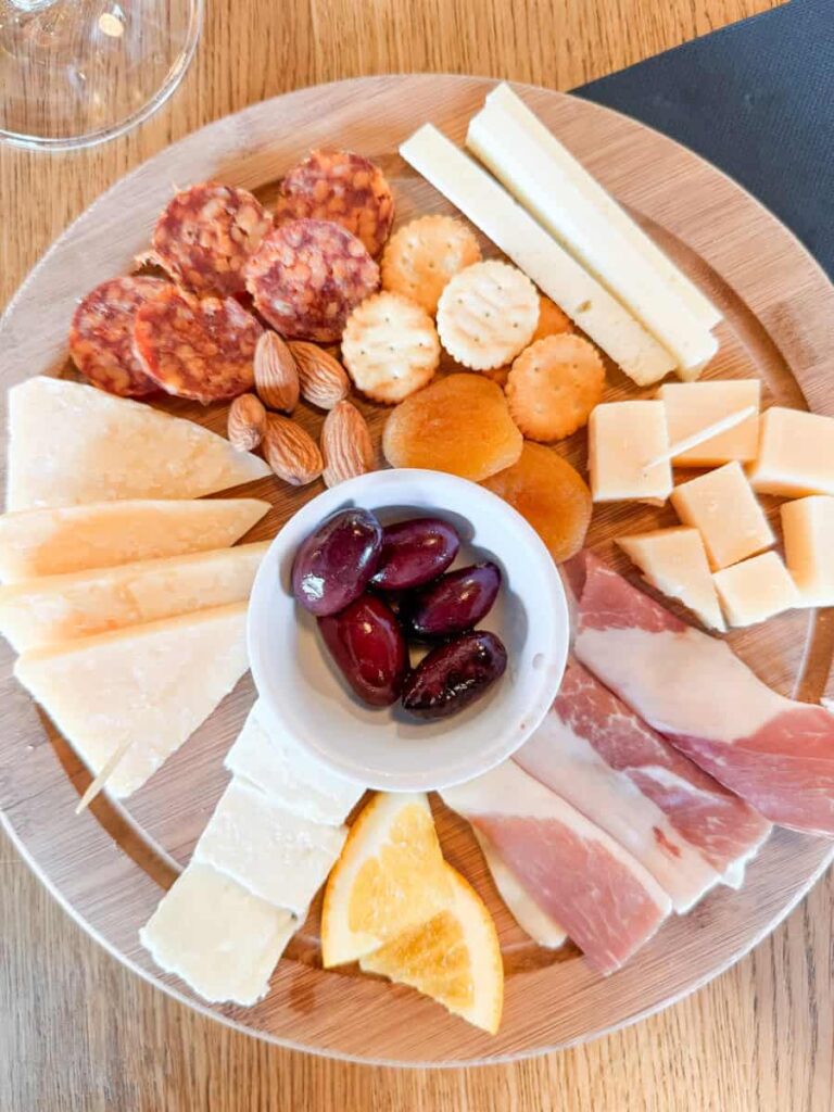 Charcuterie and cheese board with olives, almonds, and cured meats at Merga Victa Winery in Korčula.