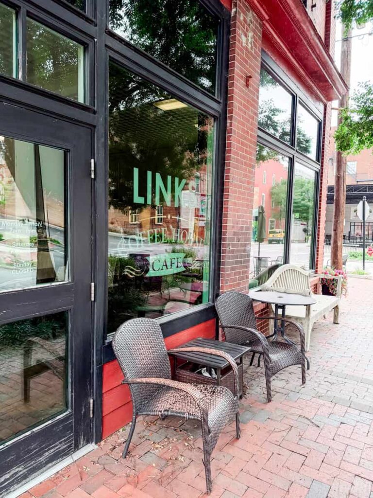 Outdoor seating in front of Links Coffee House Cafe with the "LINKS Coffee House Cafe" logo displayed on the front window.