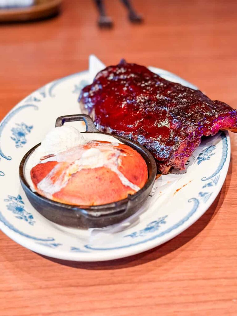 Barbecue ribs with a baked cornbread topped with honey butter at Ramsay's Kitchen.