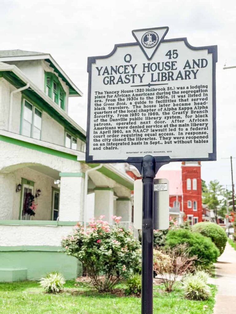 Virginia historical marker in front of the Yancey House and Grasty Library, recognizing its role as a lodging place for African American travelers during segregation and later as a branch library serving Black residents.
